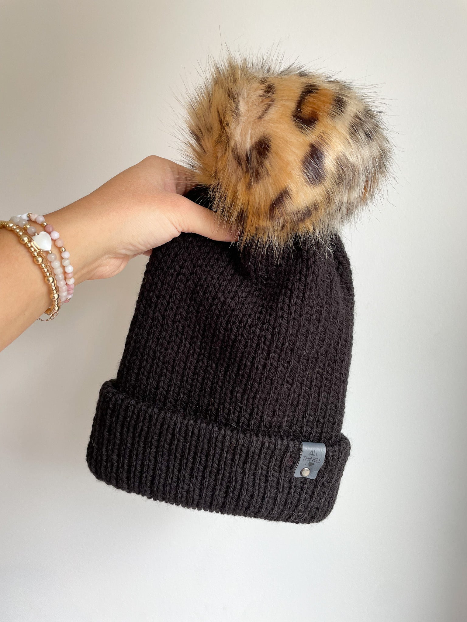 READY TO SHIP KNIT BRIM POM BEANIE, BLACK WITH LEOPARD POM