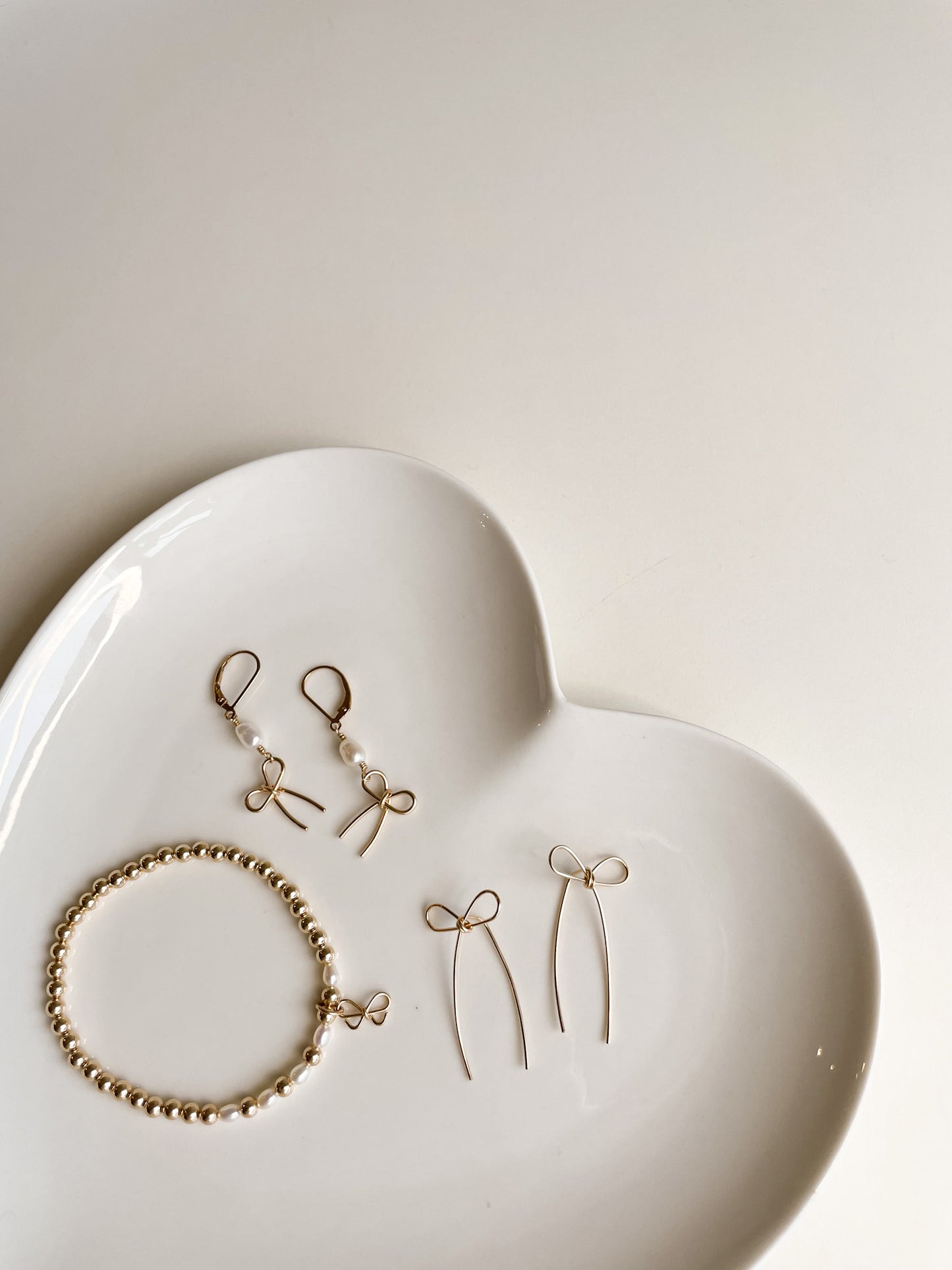 BOW THREADER EARRINGS